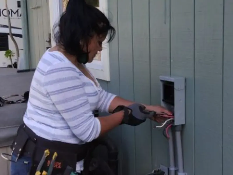 Licensed electrician wiring an exterior subpanel in Parkesburg